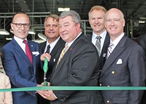 Alabama Commerce Secretary Greg Canfield, center, joined REHAU officials to mark the completion of an expansion project at the company's Cullman plant and a groundbreaking ceremony to launch construction of a technical center.