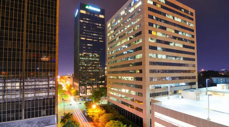 Birmingham, Alabama commercial district at night with glowing office buildings representing the state's thriving business environment.
